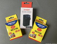 Retail boxes for two NP-F550 batteries and one Sanger charger
