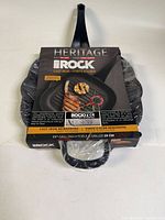 Front view of Heritage The Rock cast iron grill pan with packaging