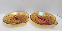 Top view of both 8" amber divided relish dishes showing iridescent Killarney pattern and central dividers