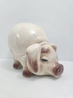 Front left view showing pig's face, ears, glaze colors