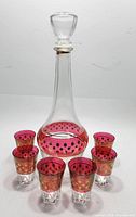 Decanter with stopper and six glasses front view