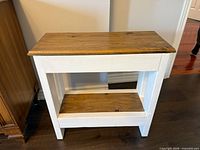 Front view of the two-tone wood side table