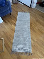 Full view of runner rug on hardwood floor