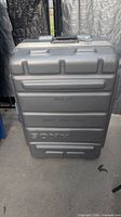 Front view of grey Sony molded road case showing exterior condition and embossed markings