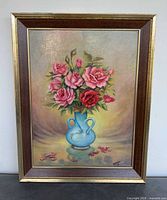 Full view of framed floral still life painting