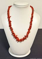 Full view of branch coral necklace on display bust
