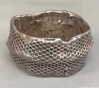 Front view of wide perforated sterling cuff