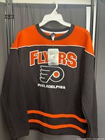 Full view of front of jersey on hanger