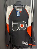 Front view of Reebok Philadelphia Flyers jersey hanging