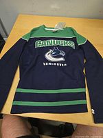 Full front view of jersey laid flat