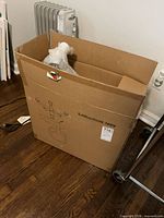 Original AmazonBasics chair carton standing upright