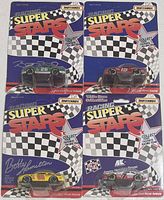 Front view of four sealed Matchbox Super Stars cards