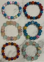 All six stretch bracelets laid out in two columns