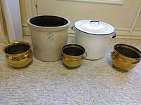 All five items: stoneware crock, enamel pot with lid, three brass planters