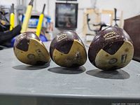 Club soles showing Genuine U.S.A Persimmon markings and numbers 1,3,5