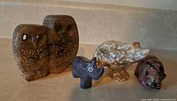Group shot of all four carved stone animals