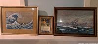 All three framed ocean themed prints displayed together