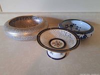 Group shot of three porcelain serving pieces