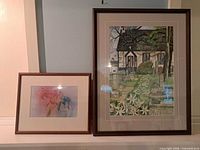 Both framed artworks side by side