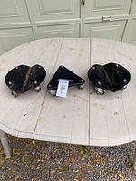 All three dollies on table: one round, two triangular