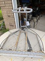Top view of full climbing tree stand showing platform, upper frame and cables