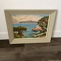 Front view of framed landscape painting