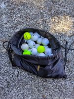 Bag opened showing mixed golf balls