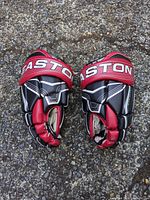 Top view of both Easton hockey gloves, showing color scheme and general wear