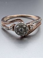 Front view showing diamond cluster halo and bypass shoulders