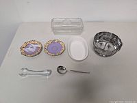All seven kitchen serveware items on table