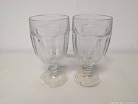 Both clear ribbed glass goblets front view