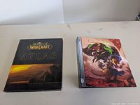 Front covers of both hardcovers displayed side by side