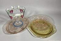 Group view of Orrefors pedestal bowl and three depression glass dishes