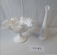 Compote and vase side by side on table