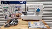Box, sewing machine, foot pedal in plastic, manuals
