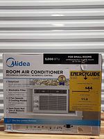 Retail box showing model details, energy guide, cooling area and size requirements