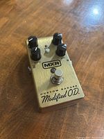 Top view of MXR Custom Badass Modified OD pedal showing controls, footswitch and branding