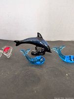 Group shot of four glass marine figurines