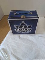 Front view of blue Toronto Marlies tin lunch box with logo