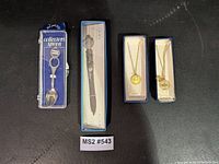 All four boxed souvenir items laid out