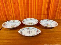 Four matching Royal Albert Petit Point bowls top view