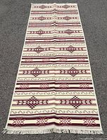 Full overhead view of entire runner rug showing full pattern and fringed ends