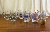 All ten glass mugs arranged on tabletop