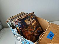 Box of assorted comics with Shadow of the Bat issue in front