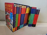 Set of seven hardcovers in slipcase with one book group removed