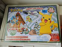 Front of sealed Pokemon Deluxe Holiday advent calendar box