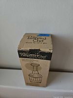 Pampered Chef branded cardboard box standing upright
