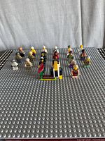 Front view of minifigures, assembled build and baseplate
