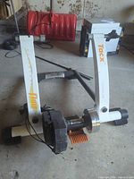 Front view of Tacx Flow trainer frame, resistance unit, cables