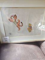 Framed cel showing both characters and studio seal